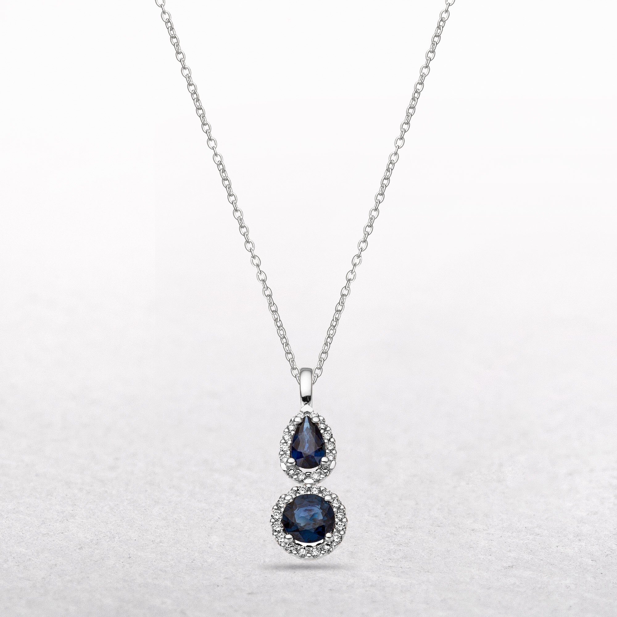 0.12ct Sapphire Pear and Round Sapphire & Diamond Pendant in 9ct White Gold