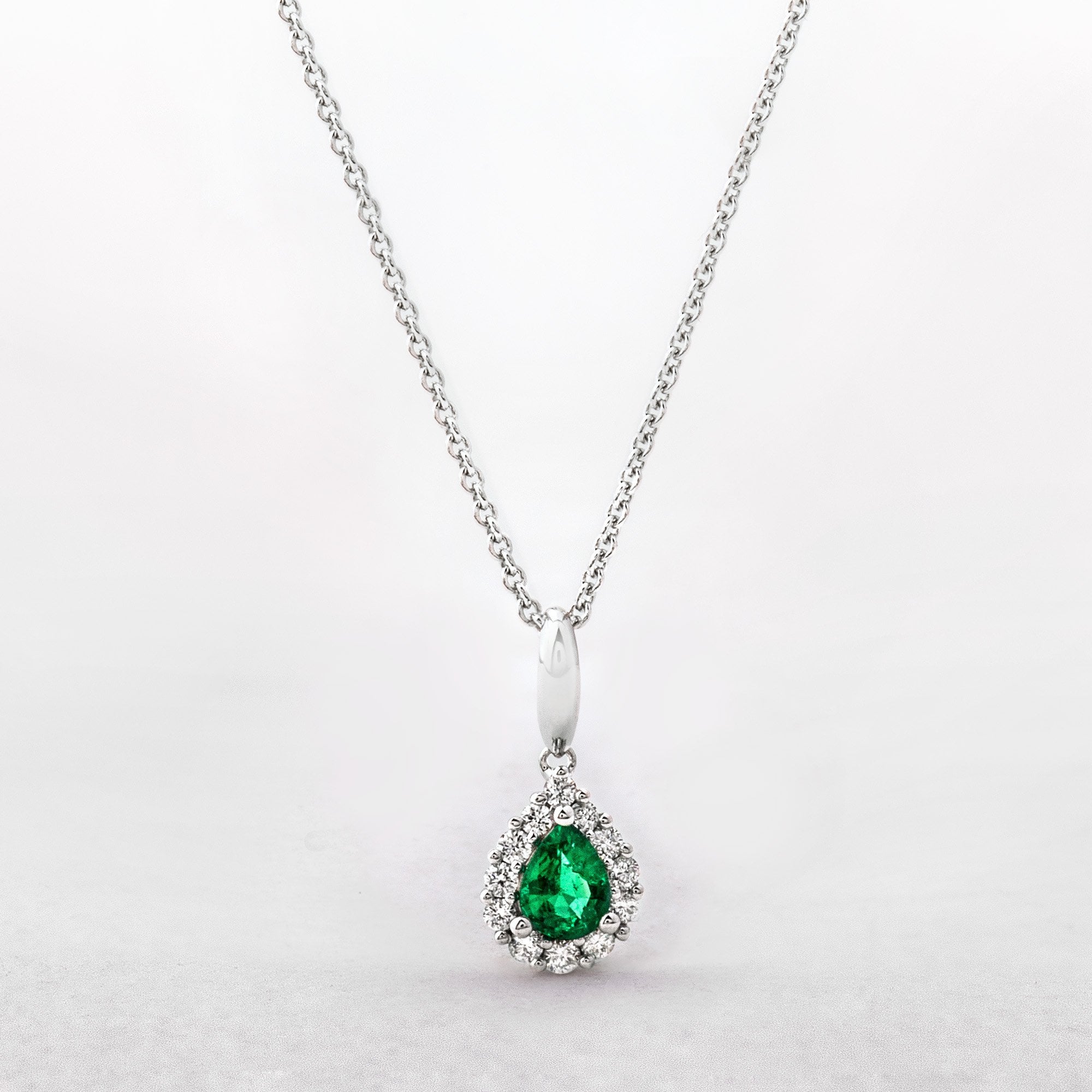 0.24ct Emerald Pear Cut & 0.16ct Natural Diamond Cluster Pendant in 18ct White Gold