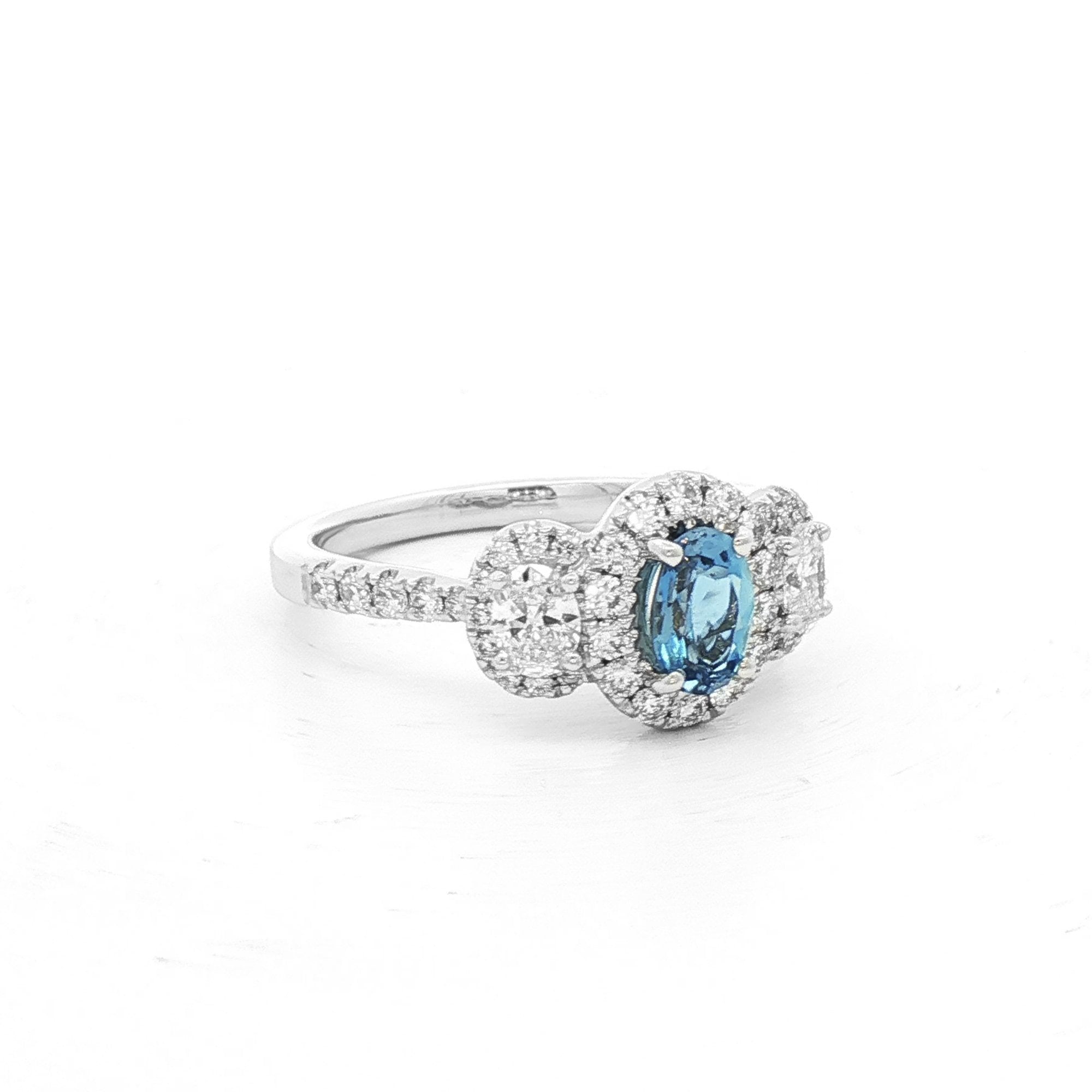 0.40ct Oval Aqua Marine & 0.70ct Natural Oval Diamond Halo Three Stone in 18ct White Gold