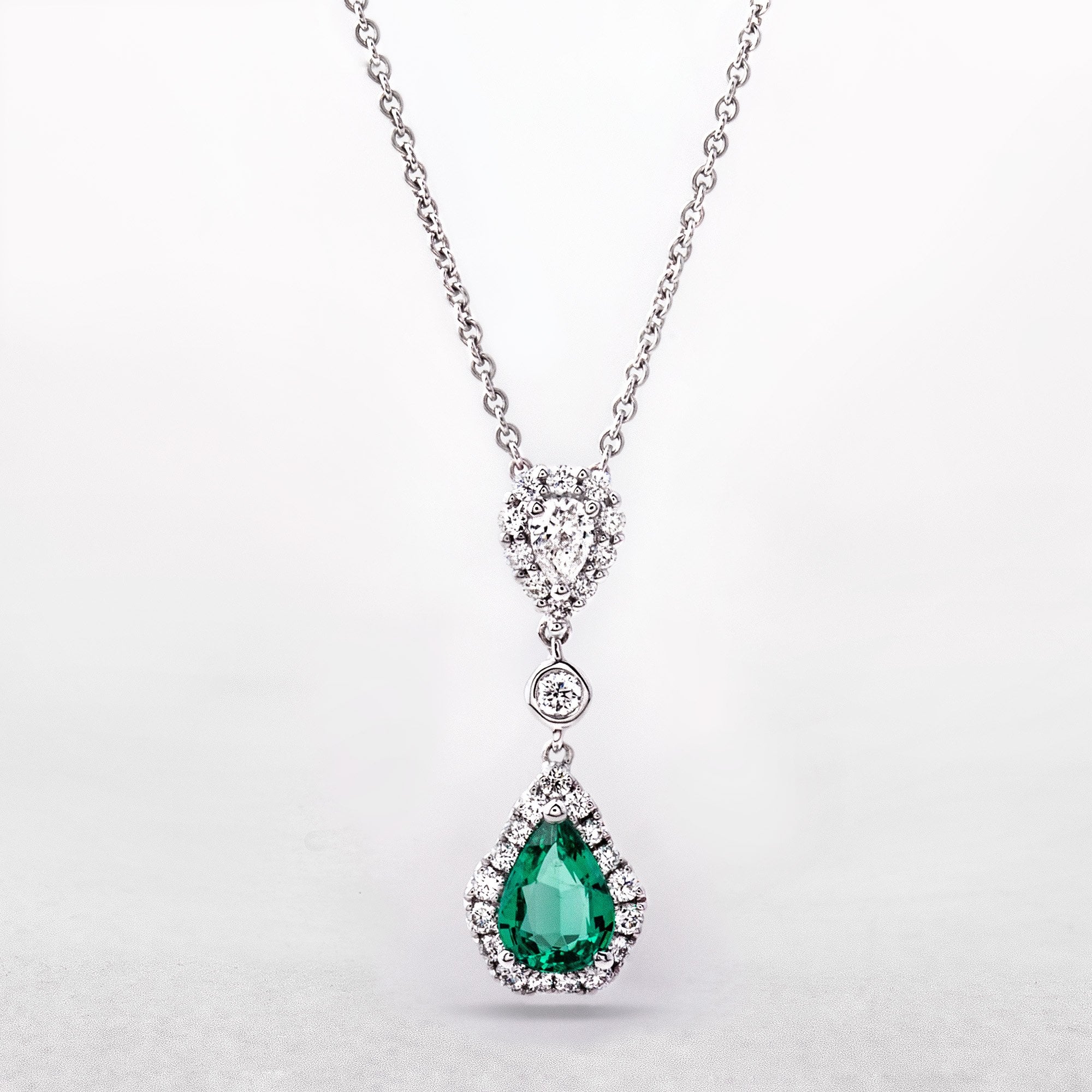0.44ct Emerald Pear-Cut & 0.37ct Natural Diamond Cluster Pendant in 18ct White Gold