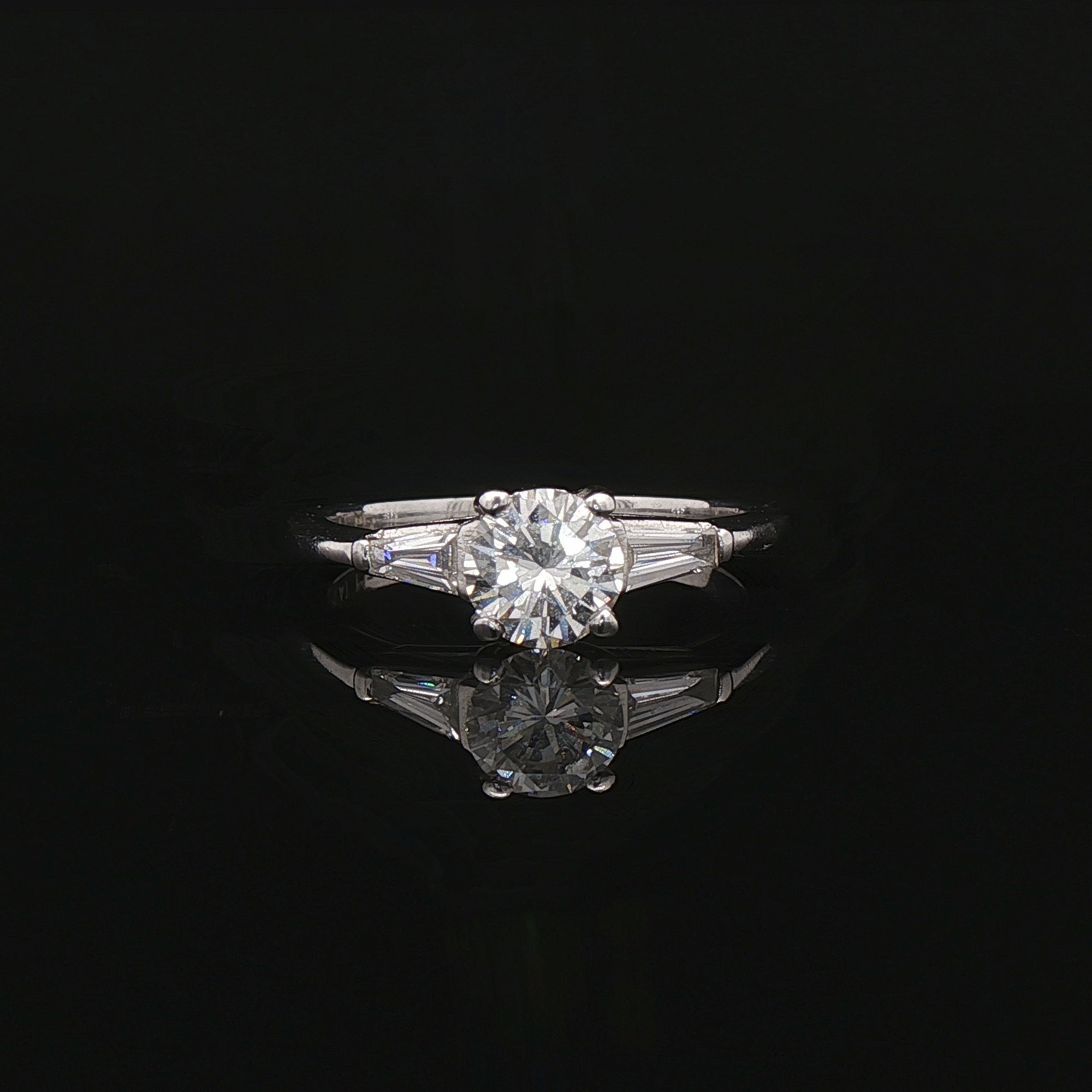 0.60ct F vs Round Brilliant Cut Natural Diamond Solitaire with Baguette Sides in Platinum
