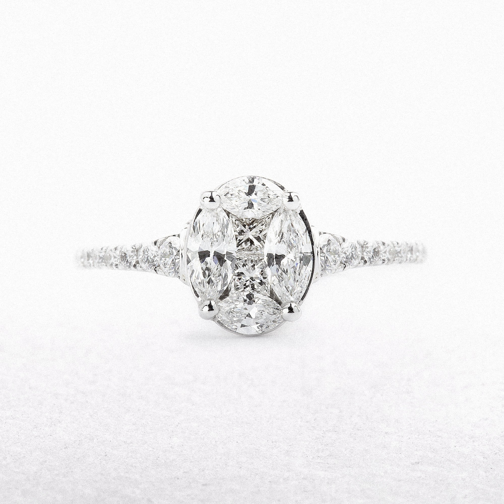 0.75ct Oval Cluster Solitaire Ring With Diamond Shoulders Set In 18ct White Gold