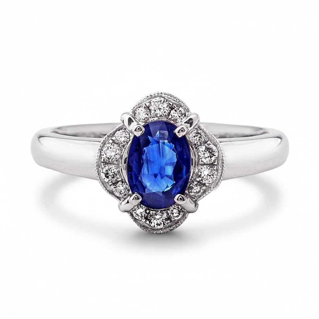 0.81ct Oval Sapphire & 0.15ct Natural Diamond Halo Cluster Ring in 18ct White Gold