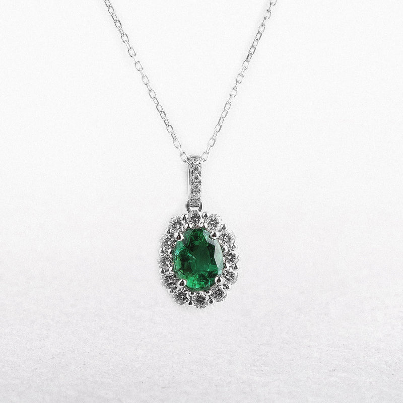 0.85ct Oval Emerald & 0.39ct Natural Diamond Halo Cluster Pendant in 18ct White Gold