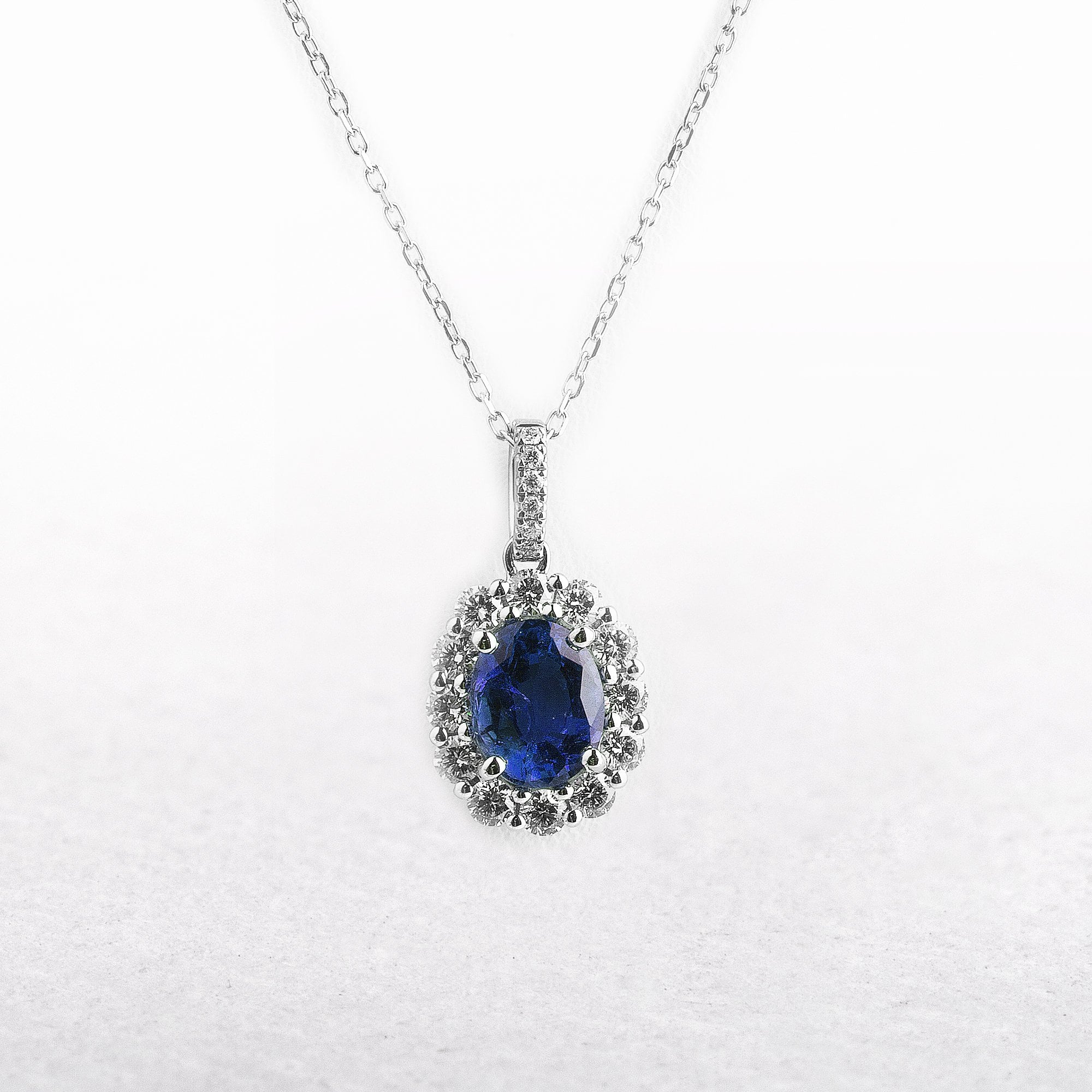 0.92ct Oval Sapphire & 0.39ct Natural Diamond Halo Pendant in 18ct White Gold