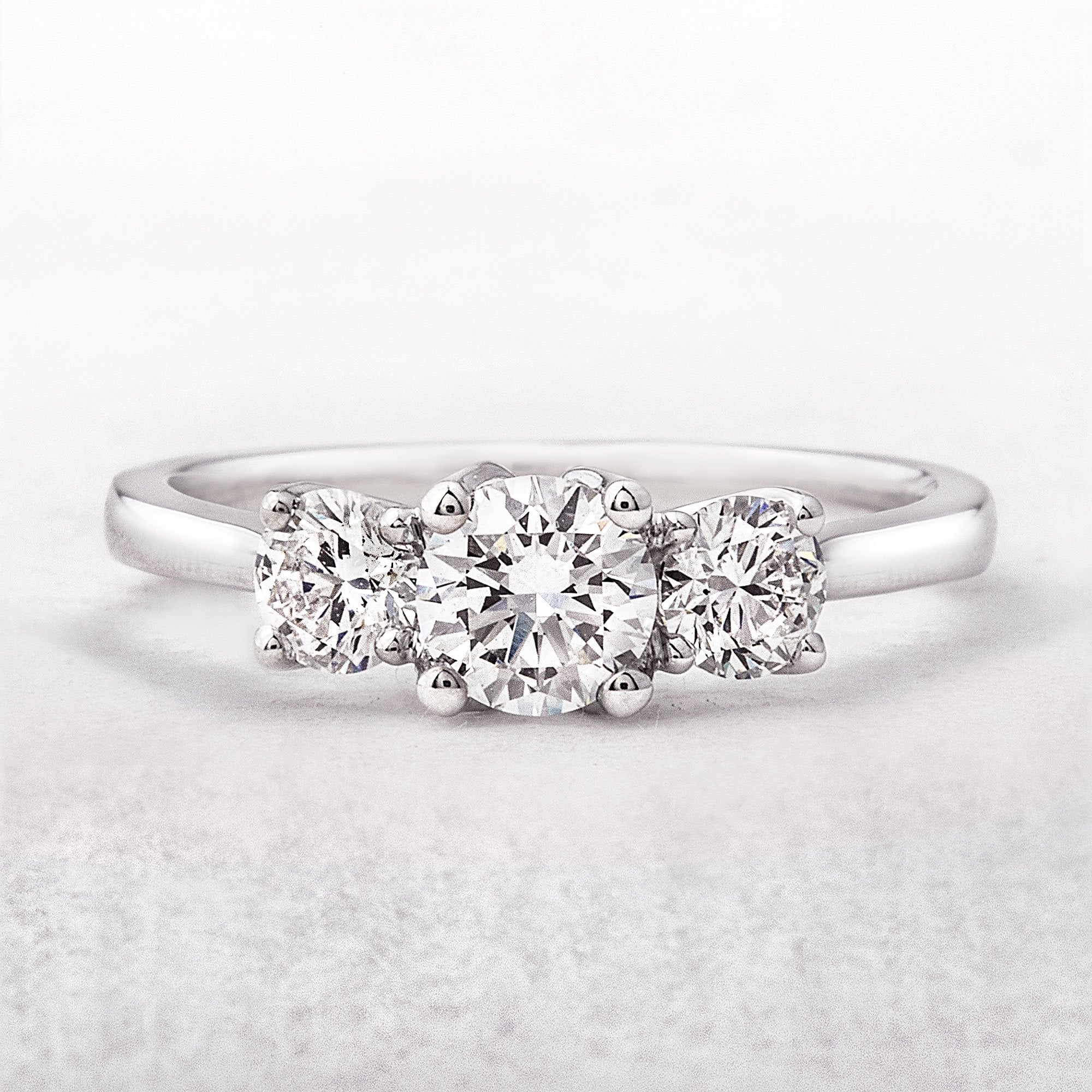 1.00ct E / SI1 GIA Certified Natural Round Cut Diamond Three Stone, Platinum Engagement Ring