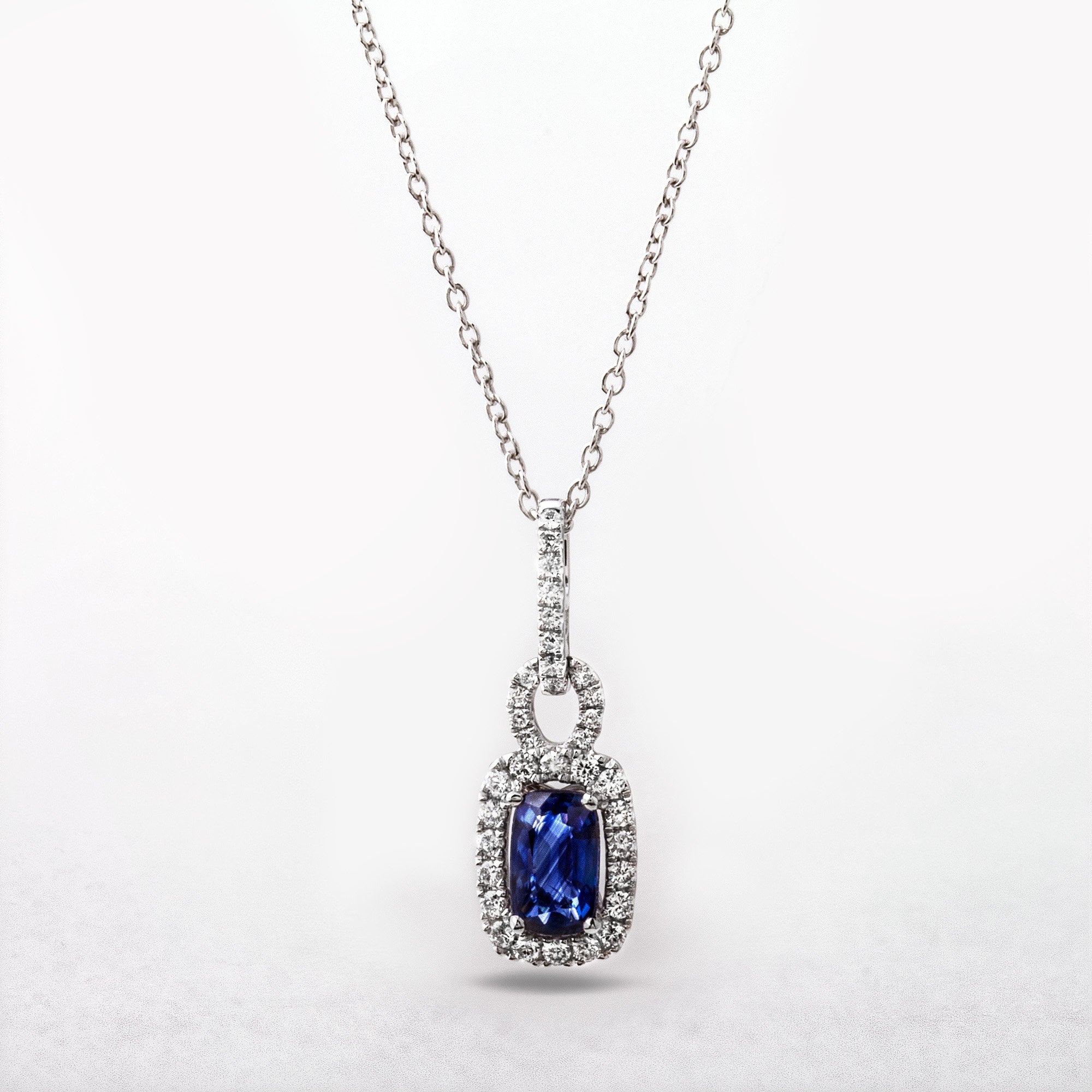 1.04ct Sapphire and 0.30ct Diamond Rectangular Halo Pendant in 18ct White Gold