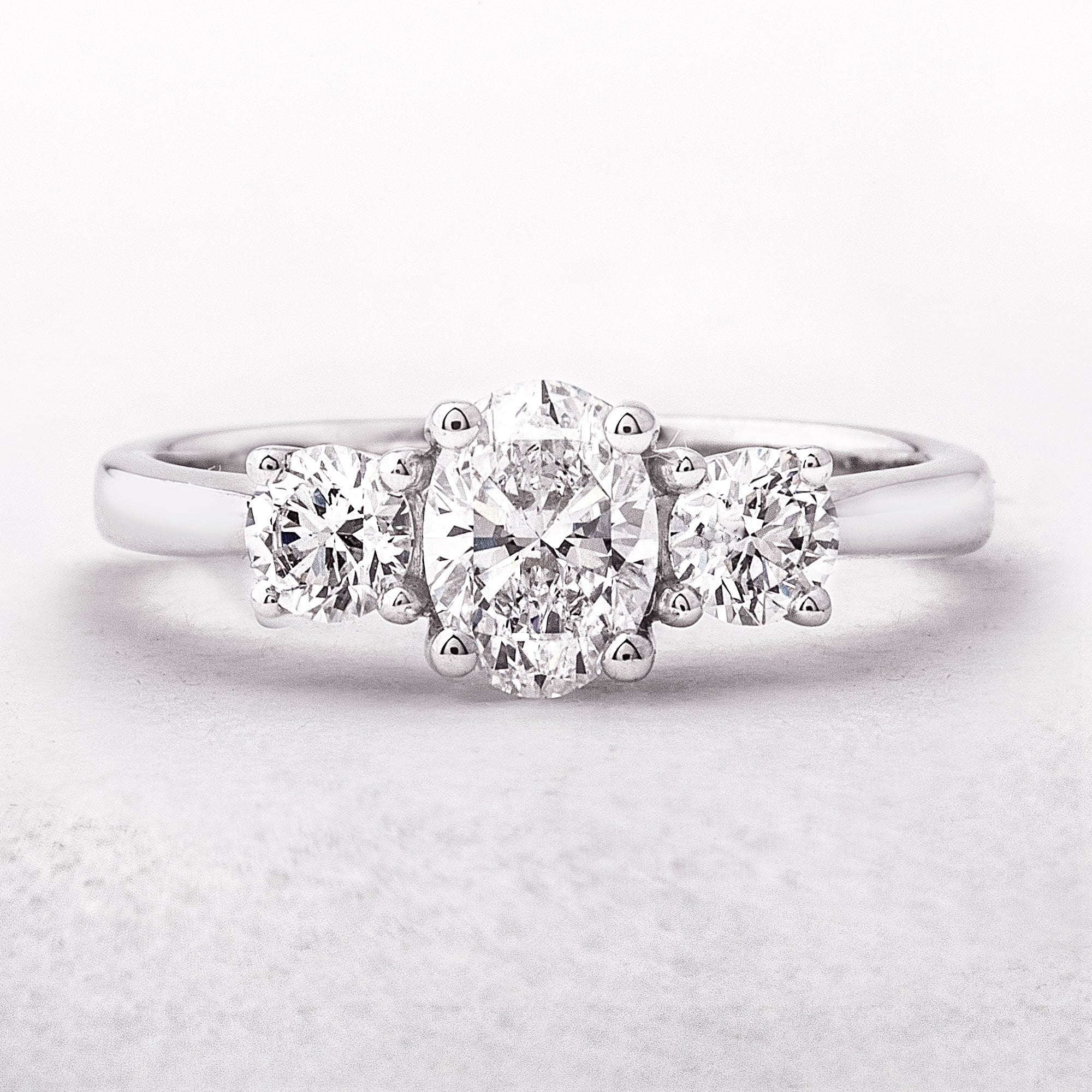 1.10ct E VS2 GIA Certified Oval Natural Diamond with Round Sides Platinum Three Stone Ring