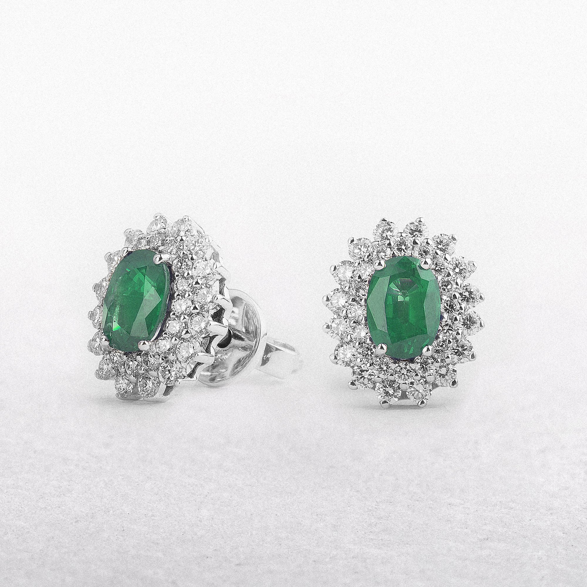 1.1ct Oval Emerald & 0.70ct Natural Diamond Double Halo Earrings in 18ct White Gold