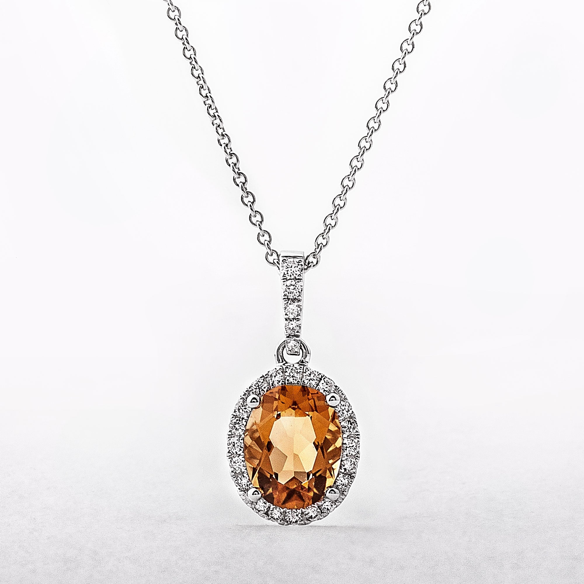 1.55ct Oval Citrine & 0.20ct Natural Diamond Halo Pendant in 18ct White Gold