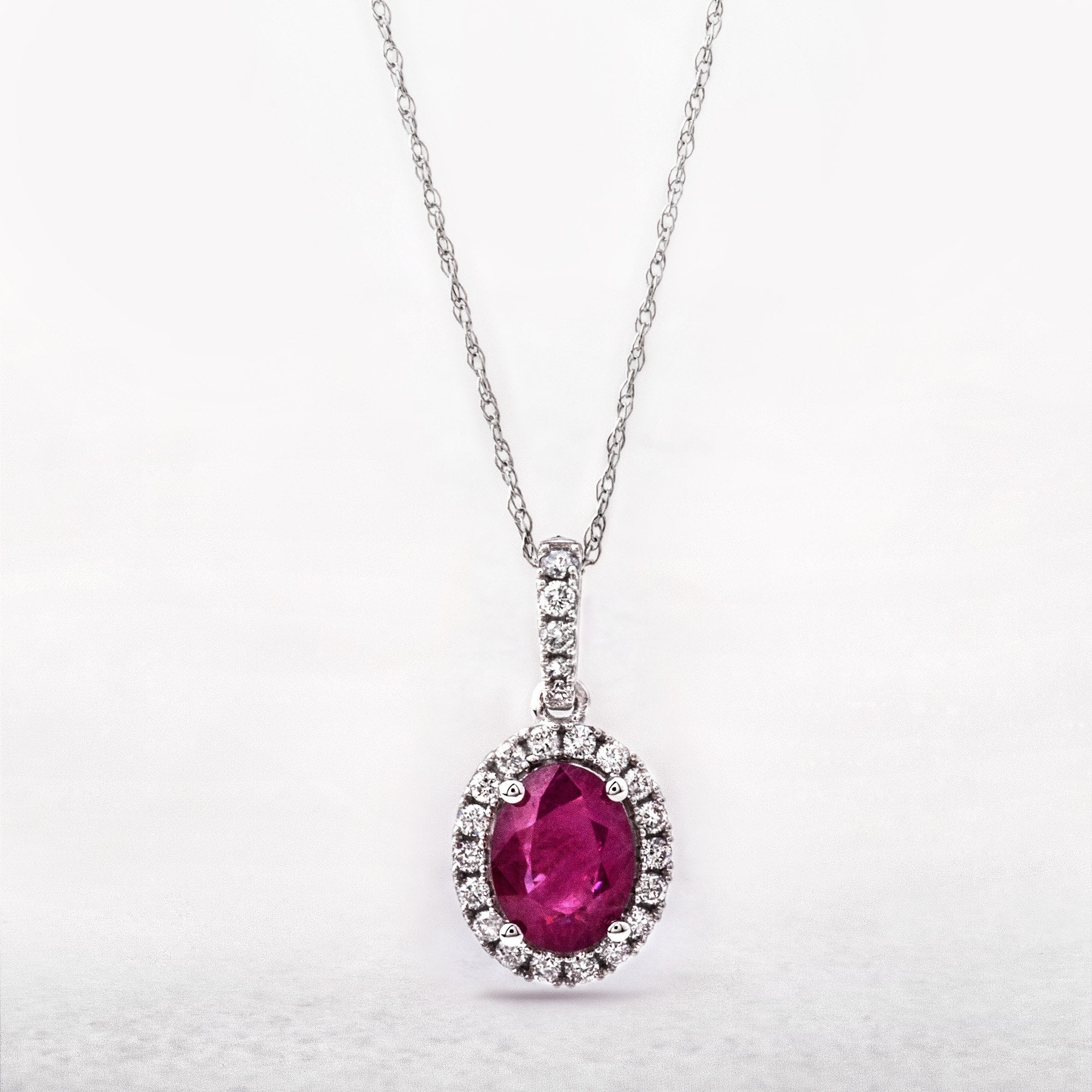 1.64ct Oval Ruby & 0.26ct Natural Diamond Pendant in 14ct White Gold