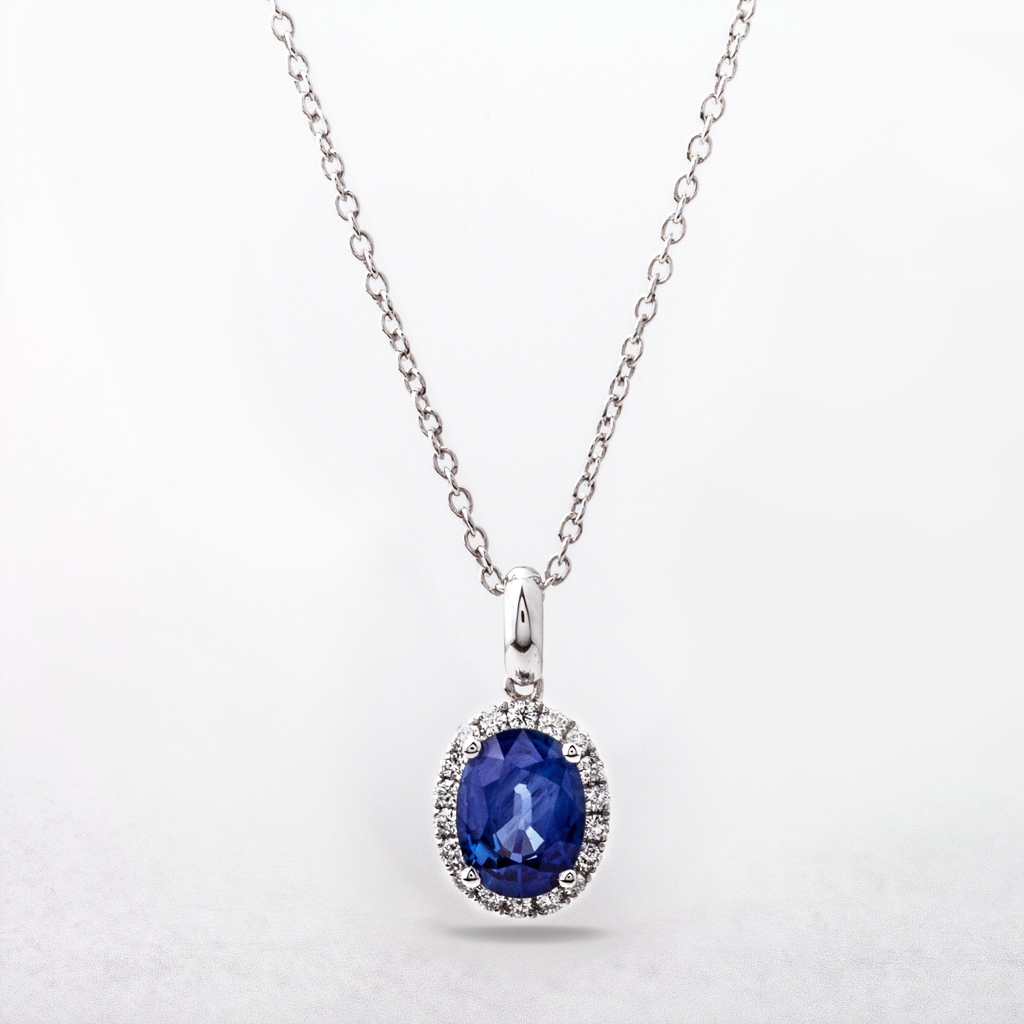 1.65ct Sapphire and 0.17ct Oval Halo Pendant in 18ct White Gold
