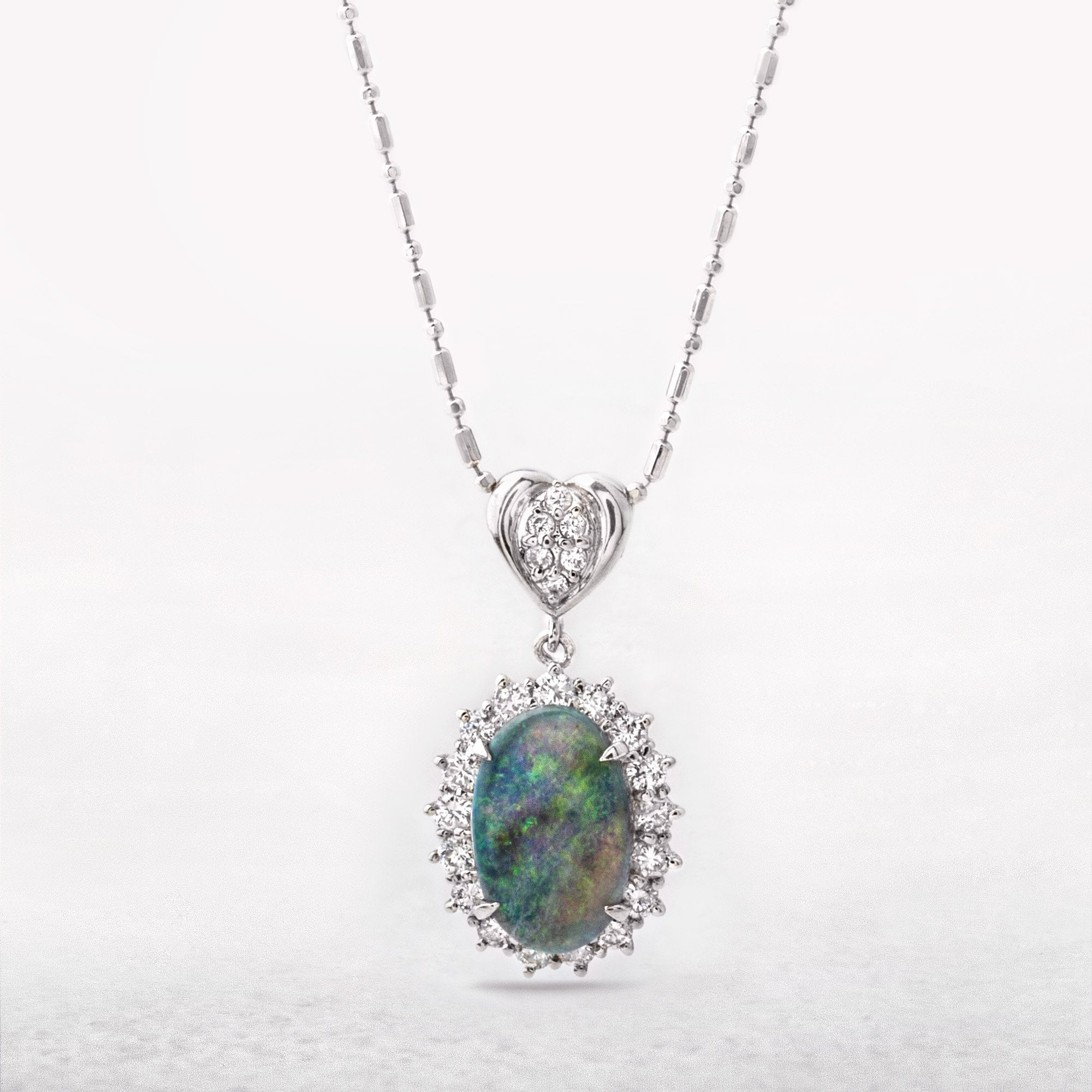 1.80ct Austrailian Black Oval Opal & 0.75ct Natural Diamond Halo Pendant in Platinum