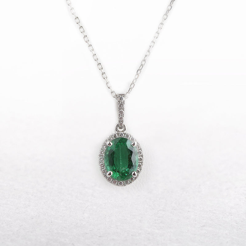1.81ct Oval Emerald & 0.20ct Natural Diamond Halo Pendant in 18ct White Gold