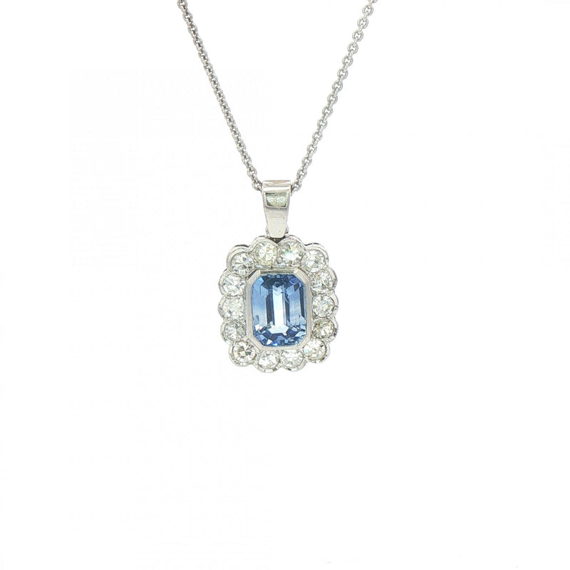 2.13ct Cushion Cut Blue Sapphire & 0.75ct Natural Diamond Halo Rub Over Setting in 18ct White Gold