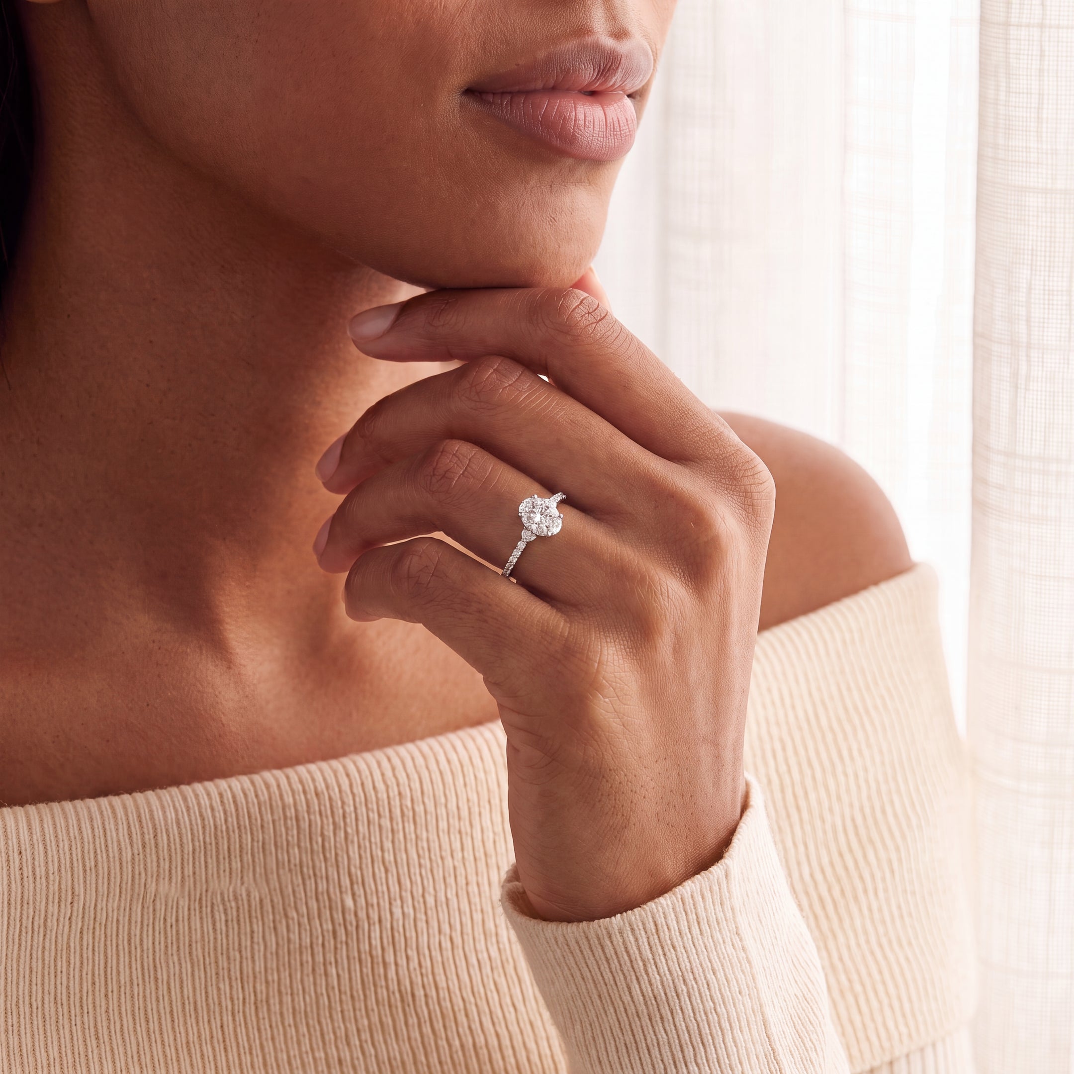 0.75ct Oval Cluster Solitaire Ring With Diamond Shoulders Set In 18ct White Gold