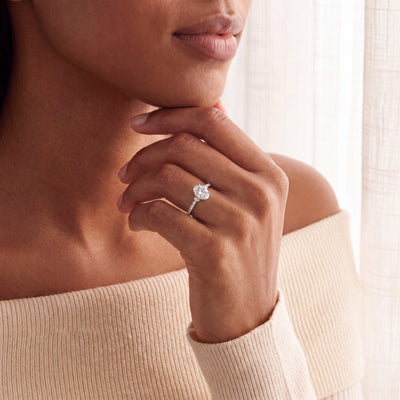 0.75ct Oval Cluster Solitaire Ring With Diamond Shoulders Set In 18ct White Gold