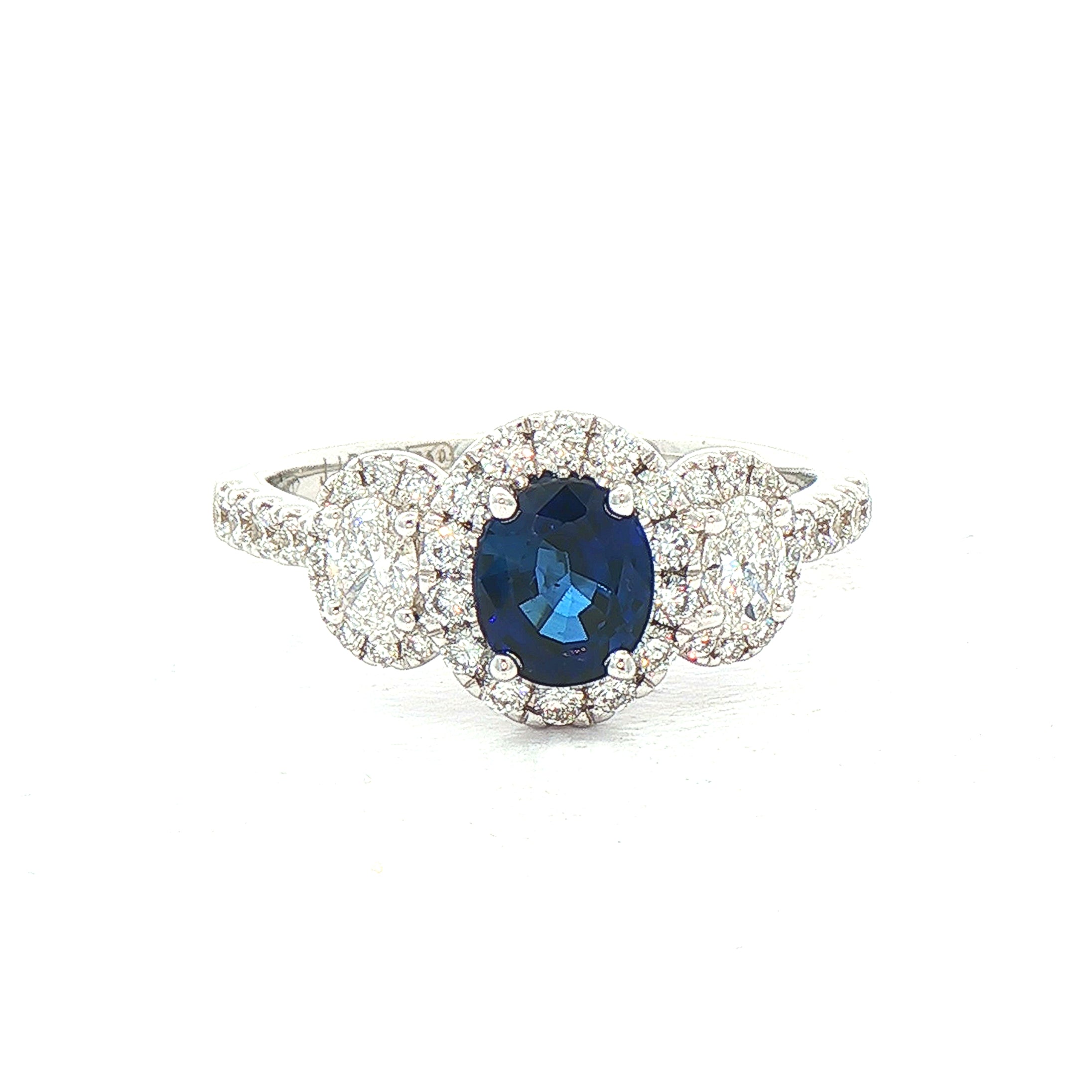 0.92ct Oval Sapphire & 0.65ct Natural Diamond Halo Three Stone in 18ct White Gold