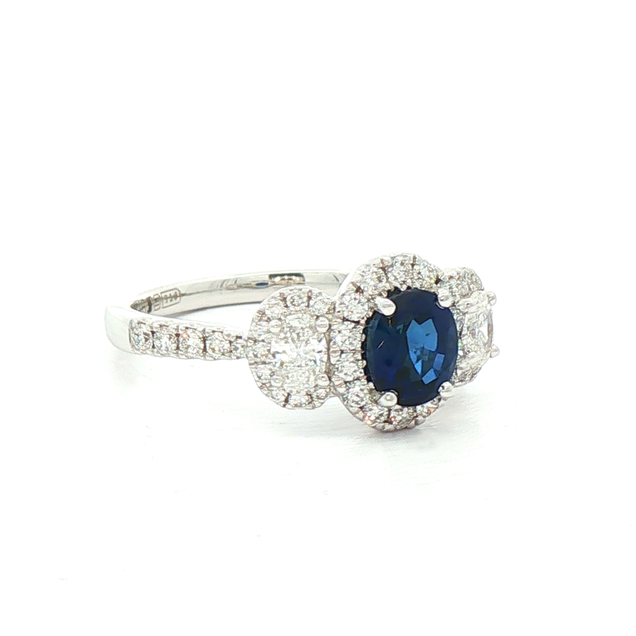 0.92ct Oval Sapphire & 0.65ct Natural Diamond Halo Three Stone in 18ct White Gold