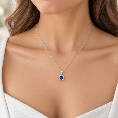 Oval Sapphire and Natural Diamond Pendant in 18ct White Gold