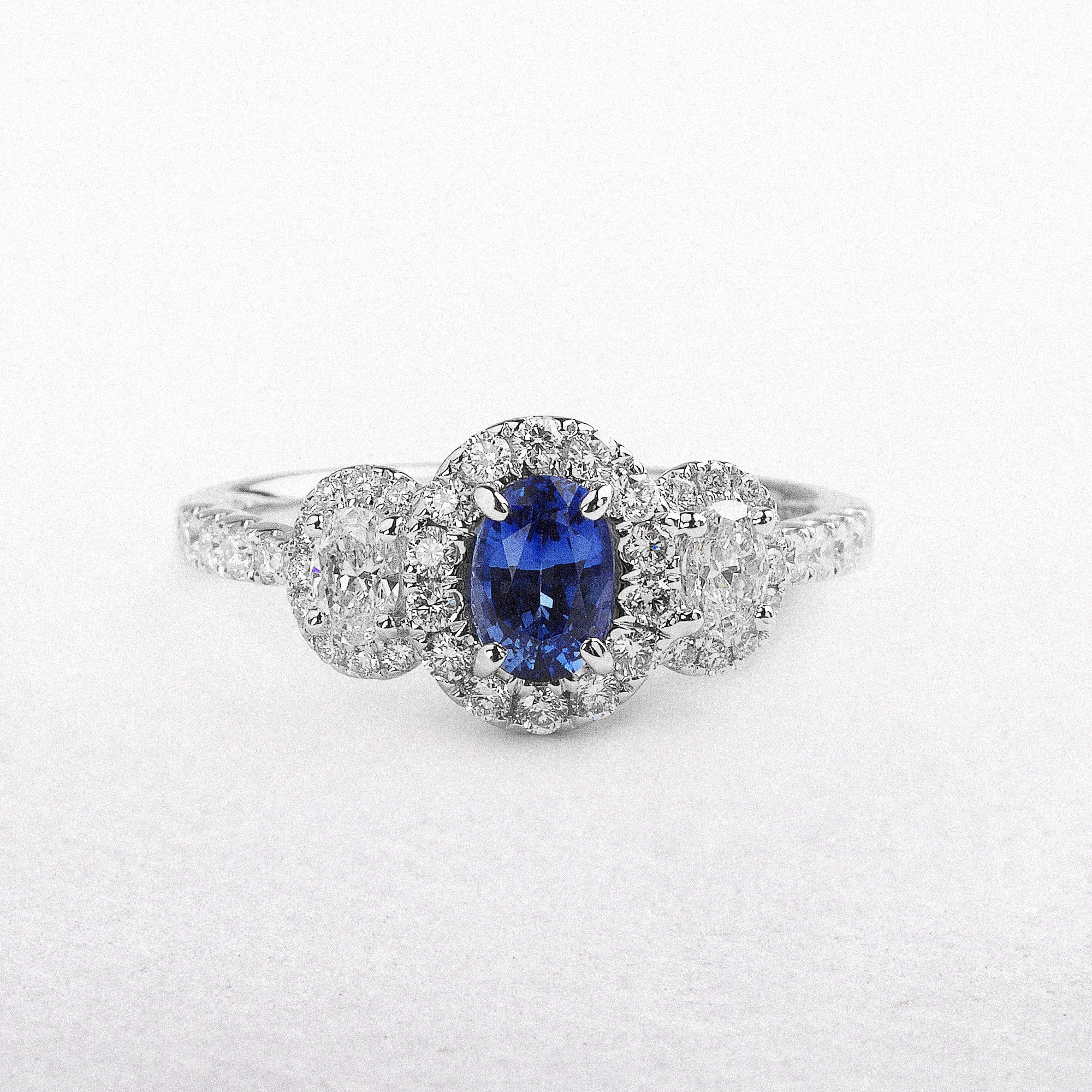 .64 18ct White Gold Ceylon Sapphire Three Stone Oval Halo With Diamonds