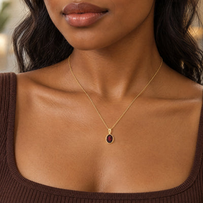 Oval Garnet Pendant in 9ct Yellow Gold
