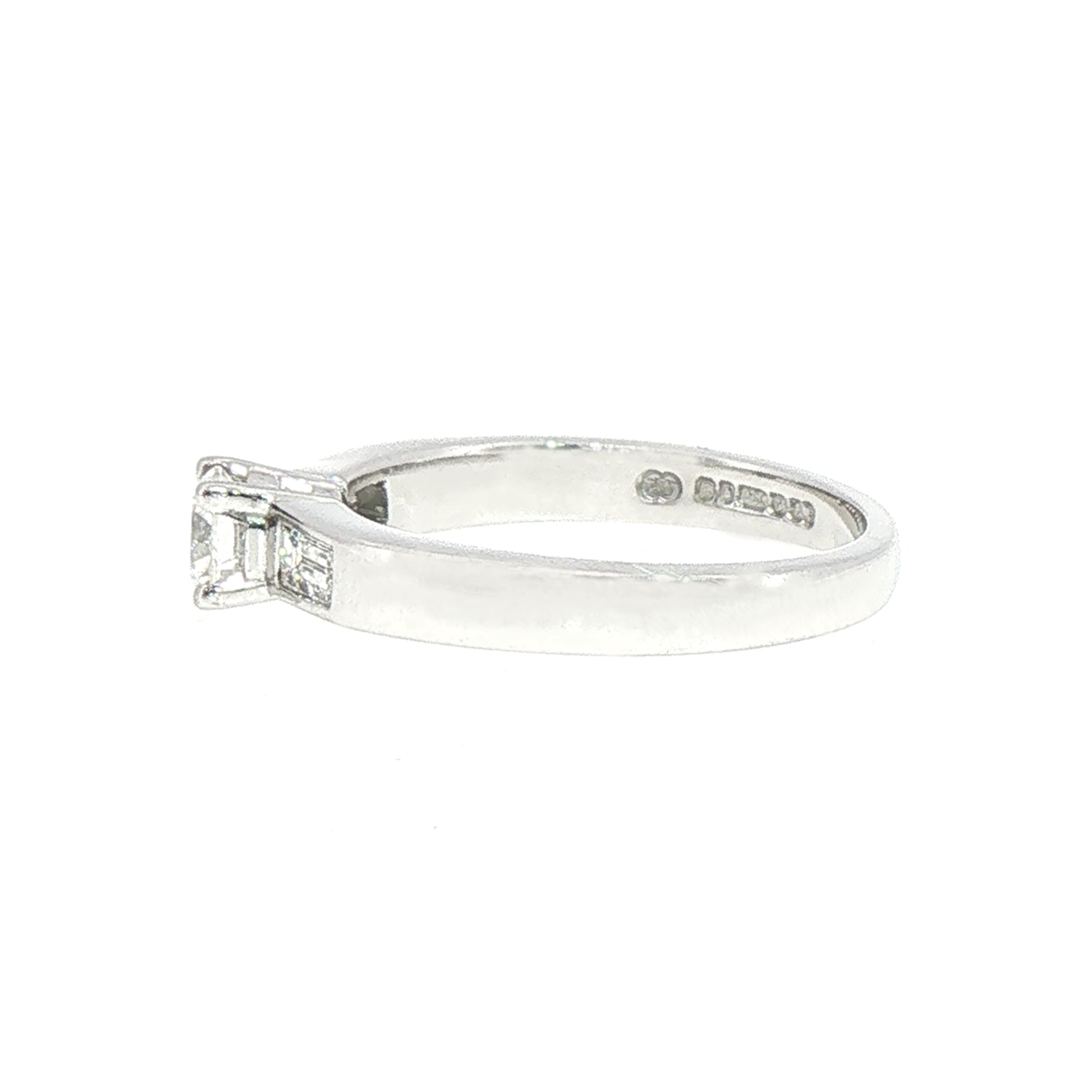 0.59ct Round Cut Natural Diamond Solitaire With Baguette Side Diamonds Set In 18ct White Gold