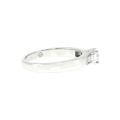 0.59ct Round Cut Natural Diamond Solitaire With Baguette Side Diamonds Set In 18ct White Gold