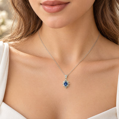 Royal Blue Sapphire and Natural Diamond Halo Pendant Necklace in White Gold