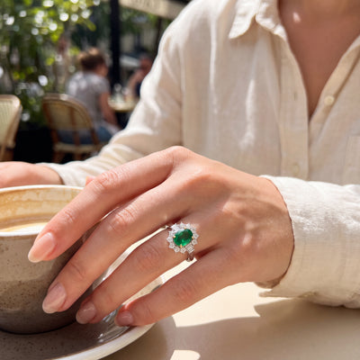 Pre-loved Platinum Oval Emerald 0.96 Cluster Natural diamond 0.55 claw set ring