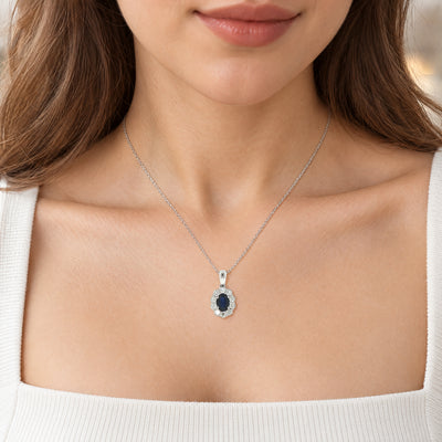 Oval Sapphire and Natural Diamond Cluster Pendant in 18ct White Gold