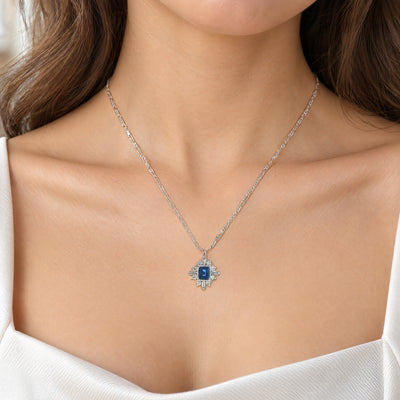 Vintage Emerald Cut Sapphire and Natural Diamond and Mixed Diamond Cluster Pendant in Platinum