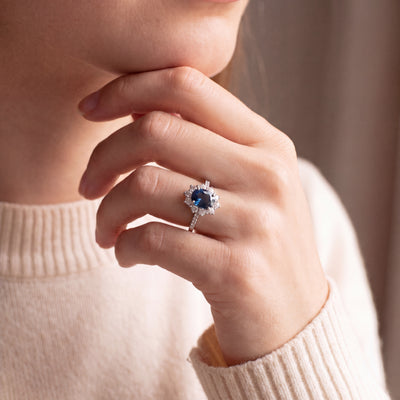 Vintage Deep Royal Blue Sapphire and Natural Diamond Halo Cluster Ring in Platinum