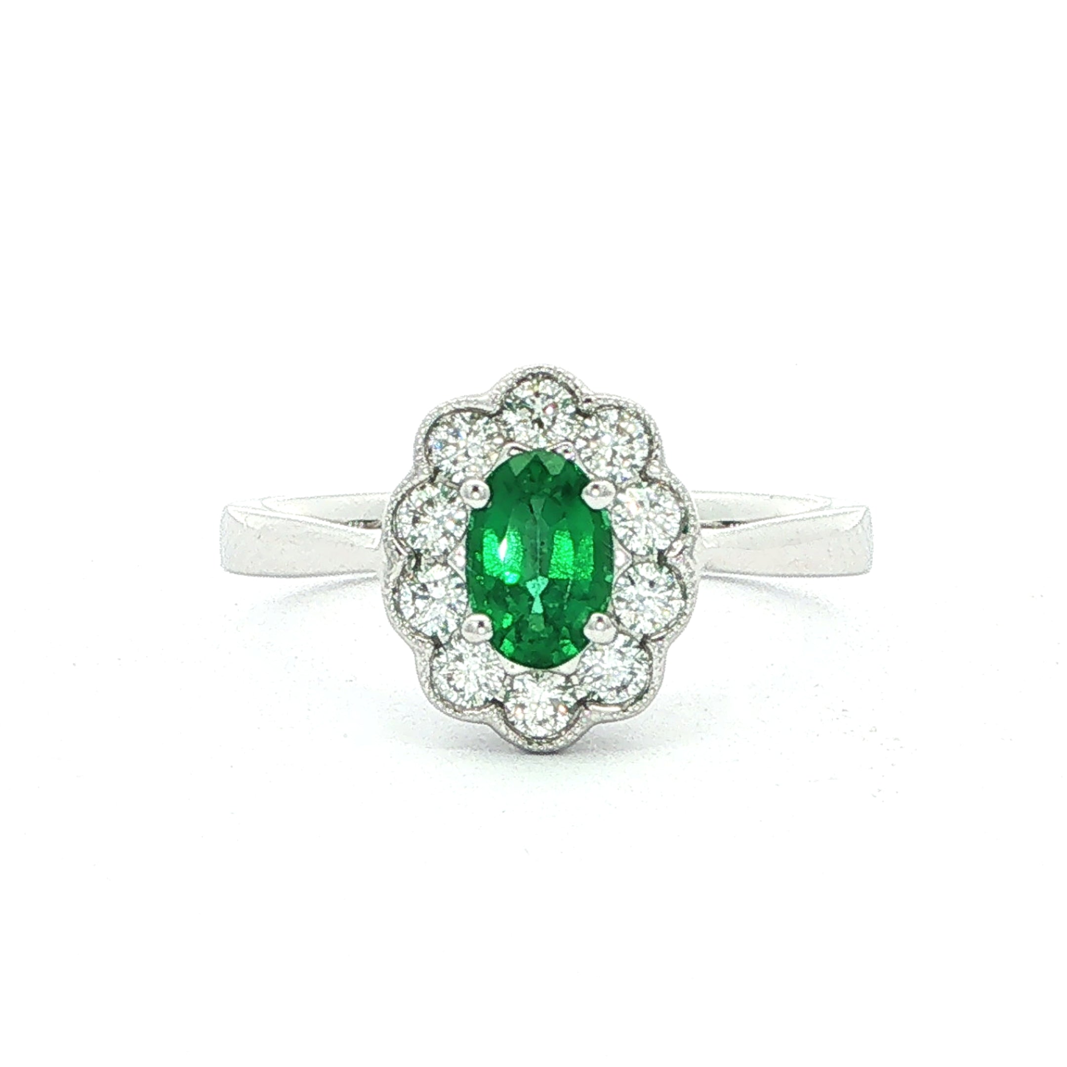 0.45ct Oval Emerald & 0.26ct Natural Diamond Cluster In 18ct White Gold