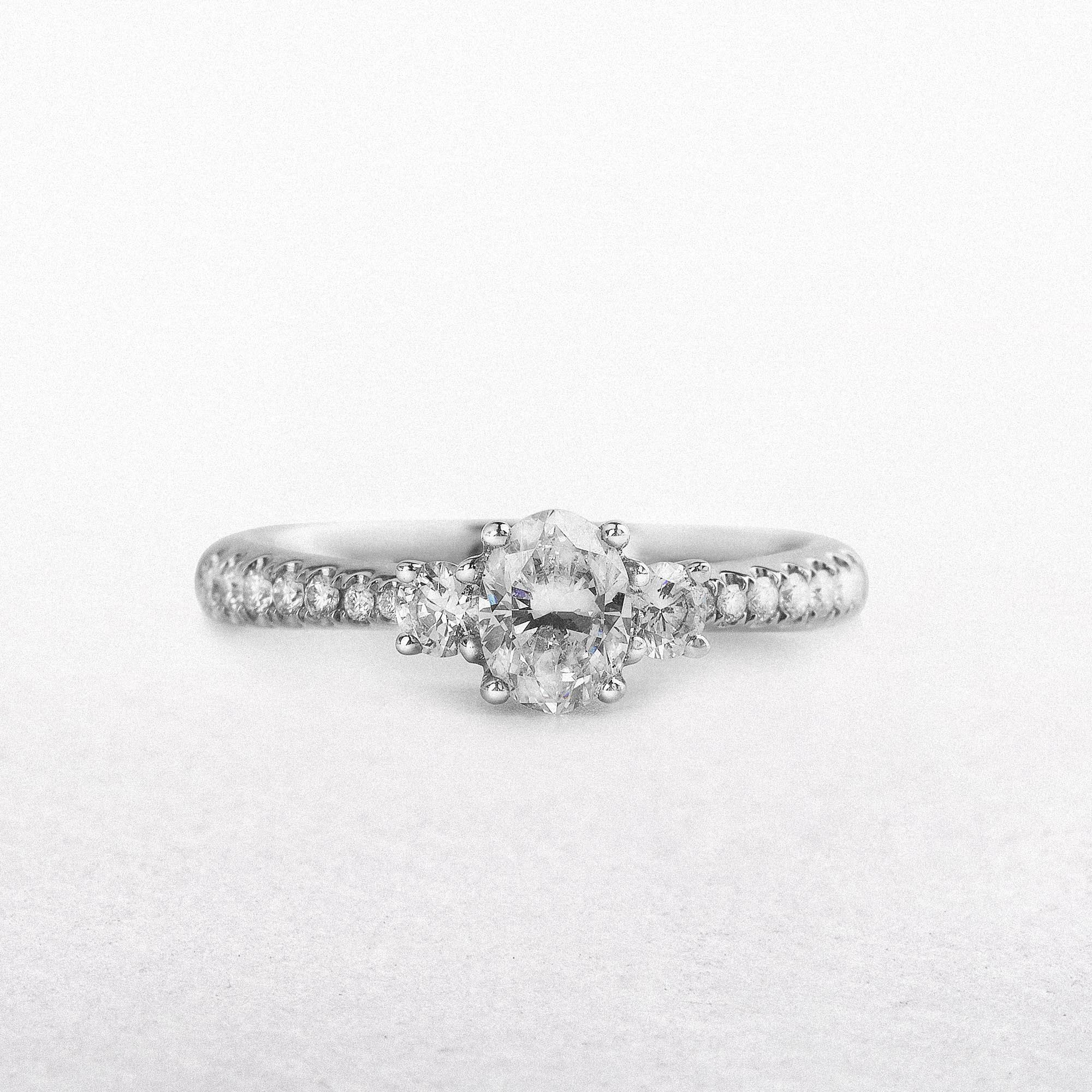 C0.50ct S0.30ct Natural Diamond Oval And Round Brilliant Three Stone Set In 18ct White Gold