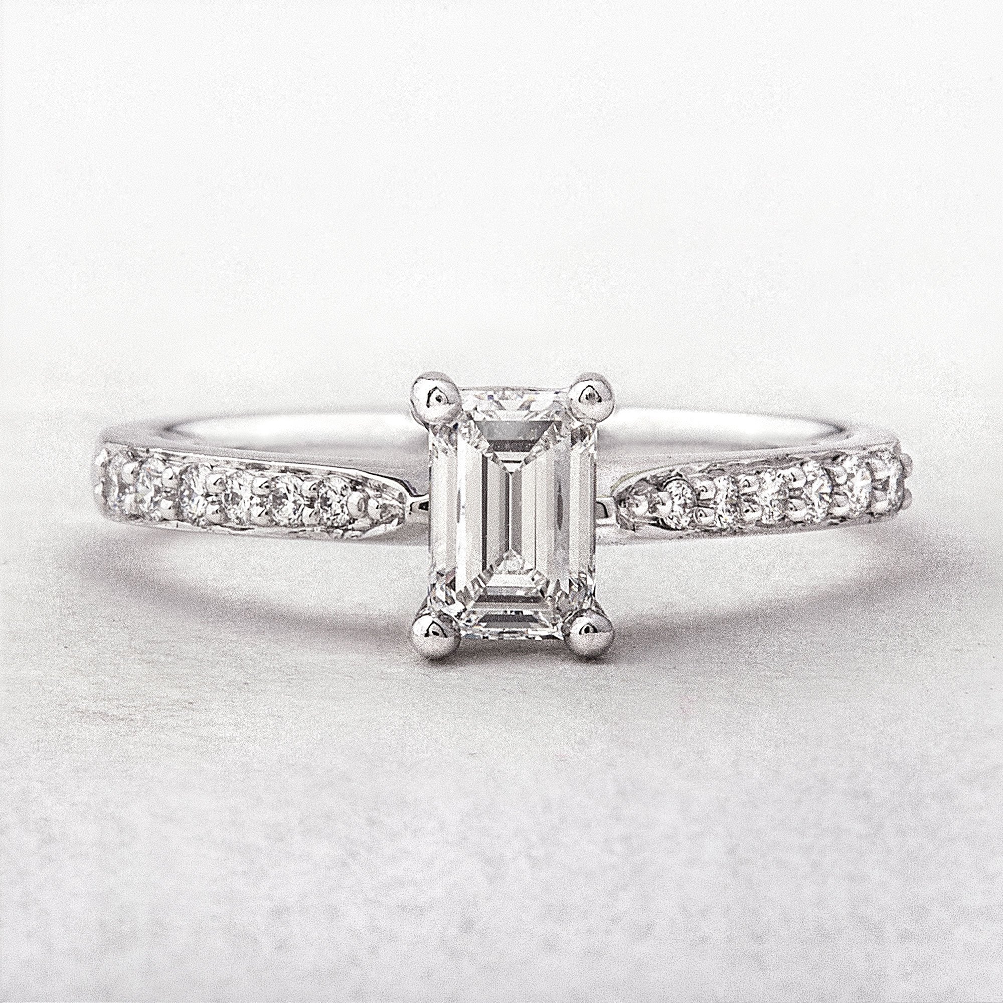 C0.68ct S0.14ct E vvs2 Natural Diamond Emerald Cut Solitaire With Diamond Shoulders Set In Platinum