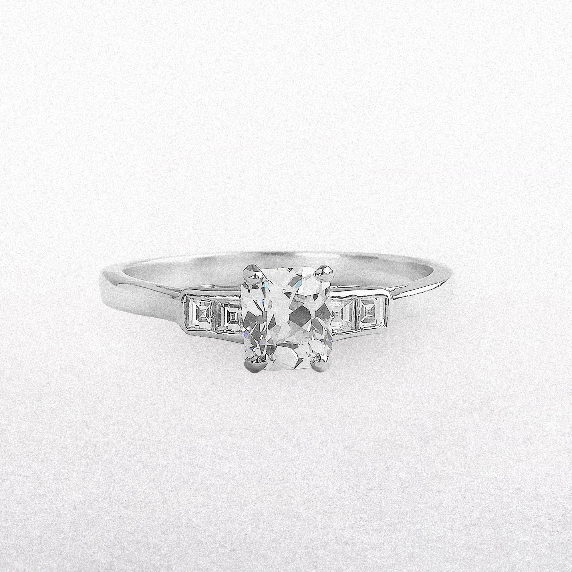 C0.73ct S0.11ct G si1 Cushion Cut Solitaire With Assher Side Diamonds Set In Platinum