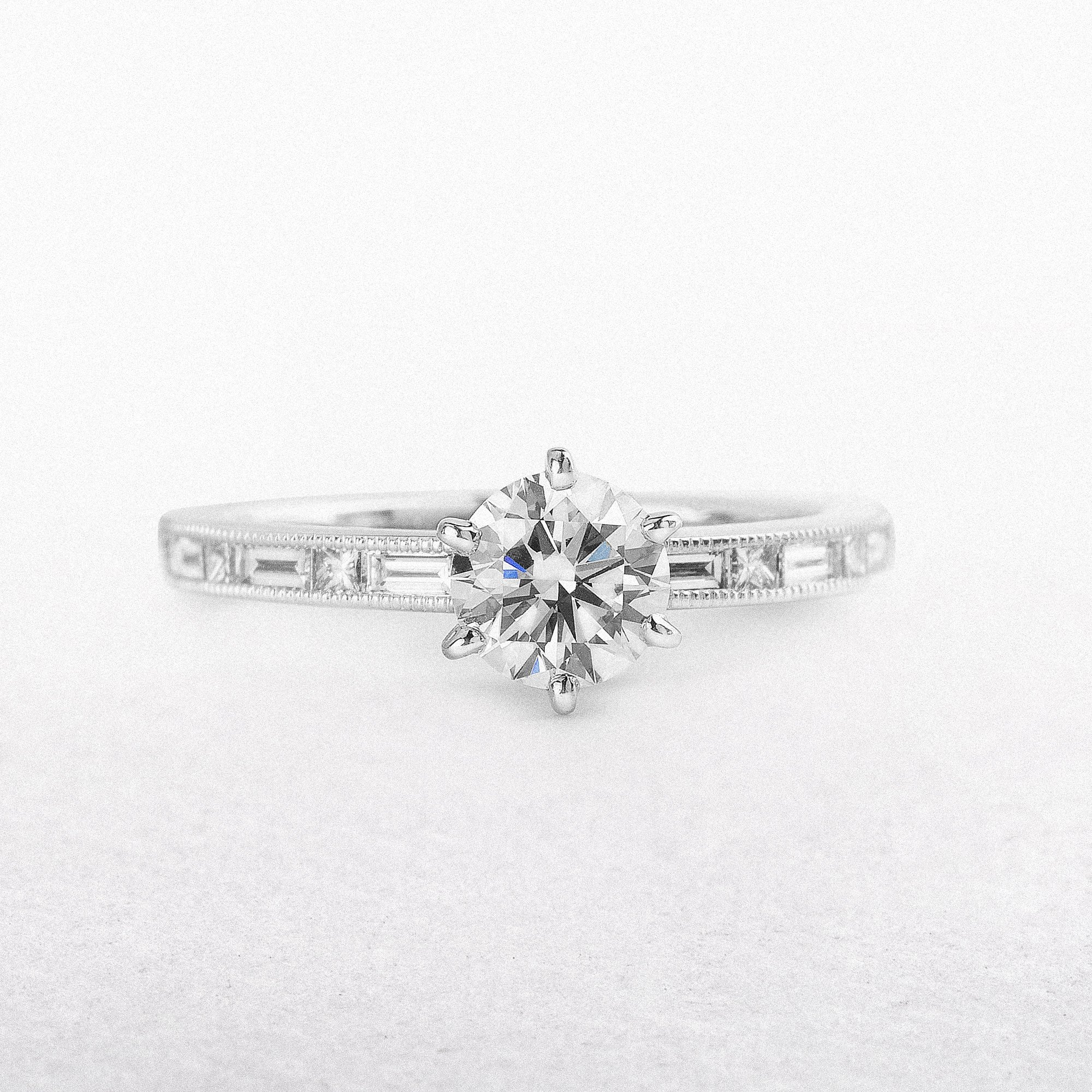 C0.80ct S0.38ct Diamond Solitaire With Baguette & Princess Cut Diamond Shoulders In 18ct White Gold