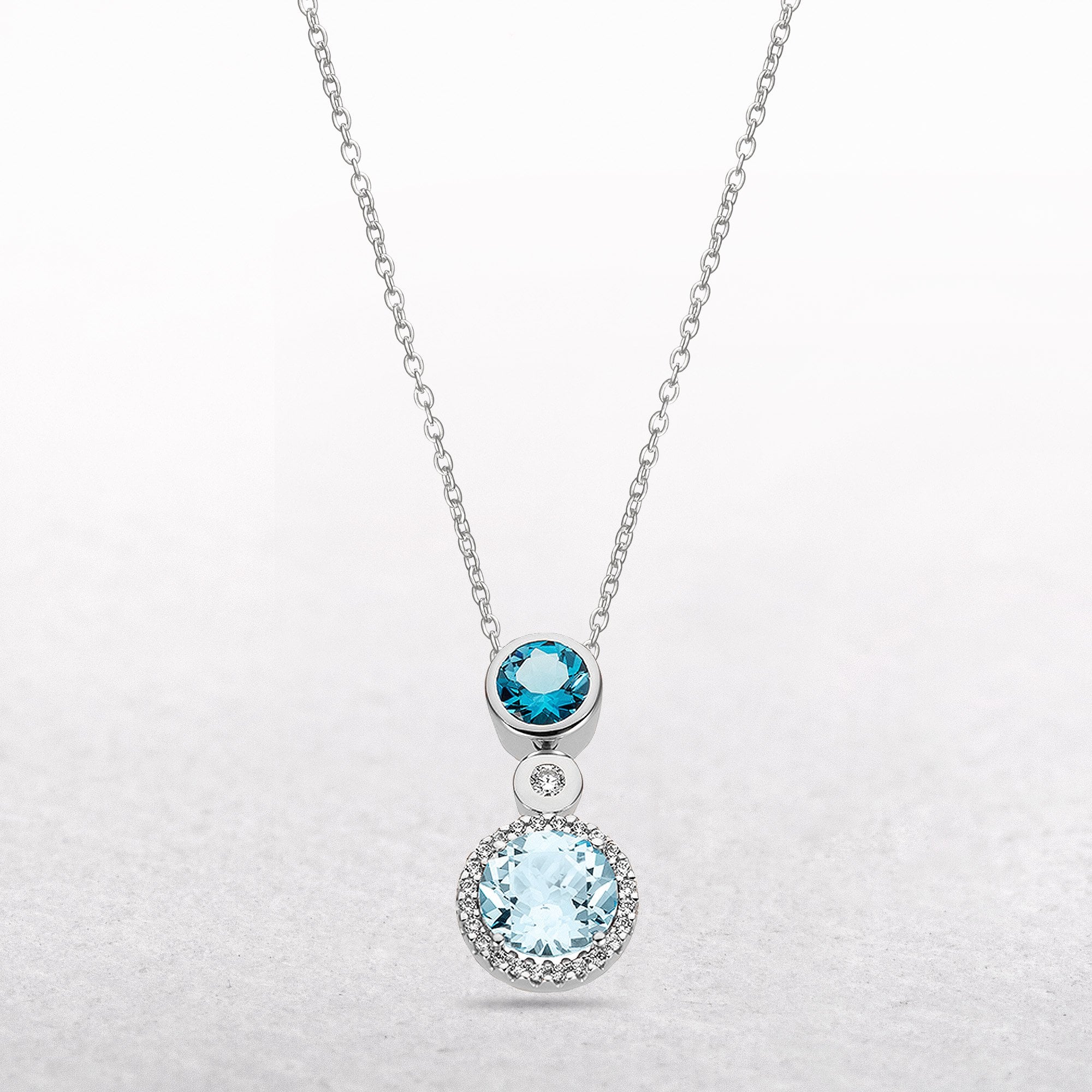Diamond and Blue Topaz Round Pendant in 9ct White Gold