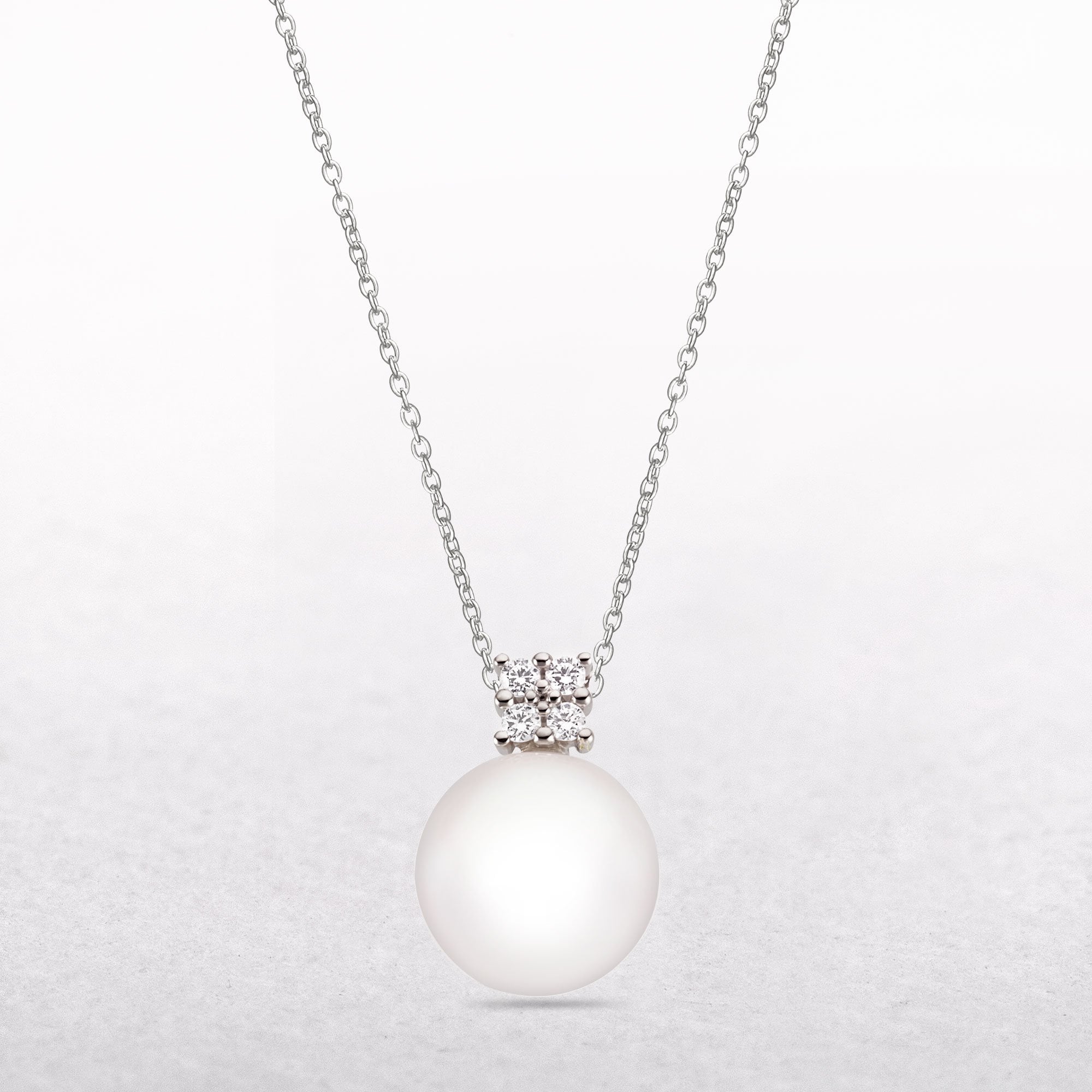 Four Cubic Zirconia Pearl Pendant in 9ct White Gold