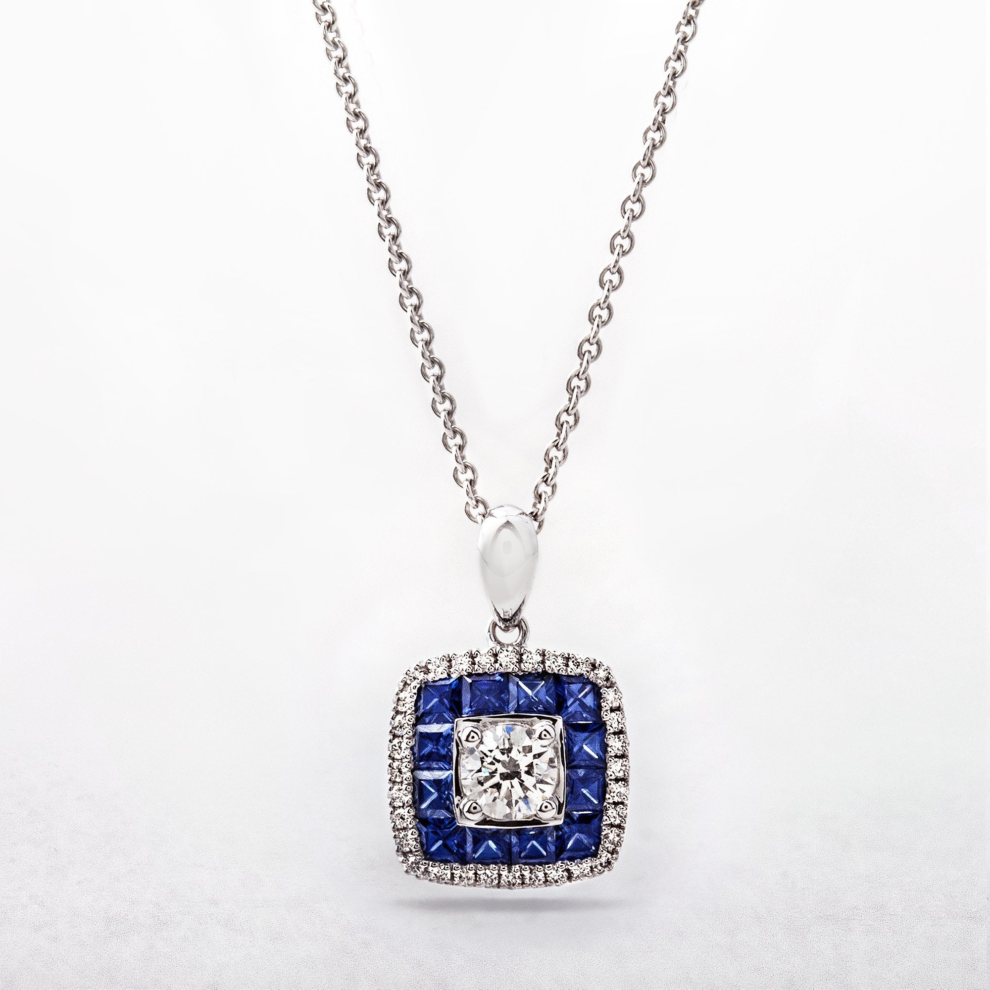 S0.54CT D0.25ct Sapphire And Diamond Cushion Shaped Target Pendant in 18ct White Gold