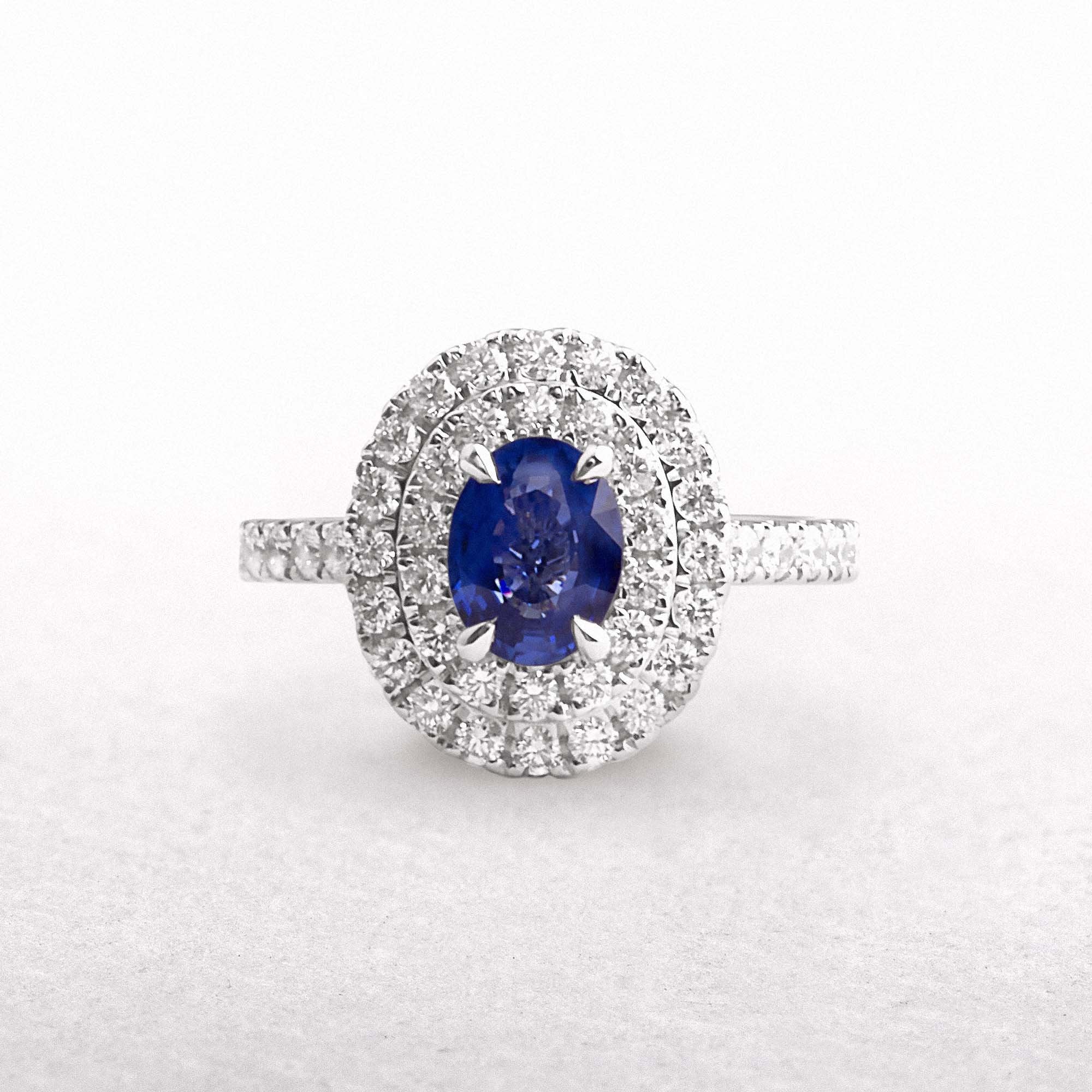 18ct White Gold Oval Sapphire & Natural Diamond Halo Ring