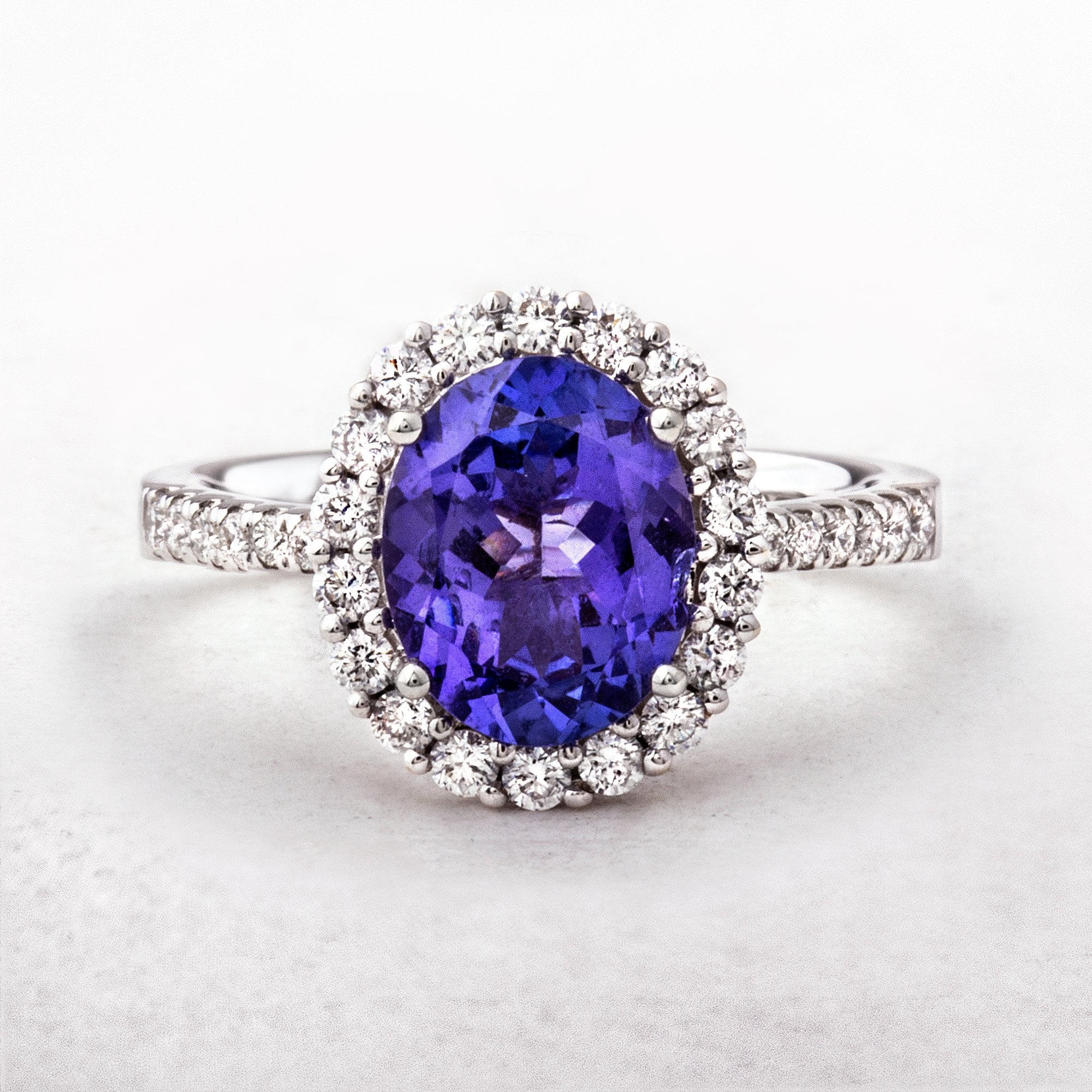 Tanzanite and Diamond Oval Cut Halo Gemstone Ring in 18ct White Gold
